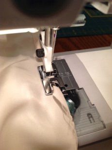 Hemming the lining. 